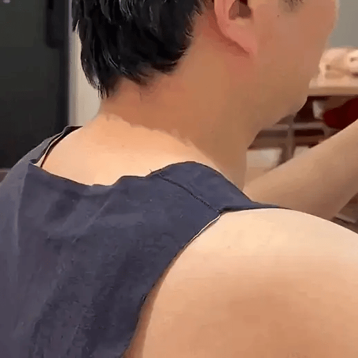 Close-up of Handy Neck Massager providing soothing heated compression on the neck for stress relief